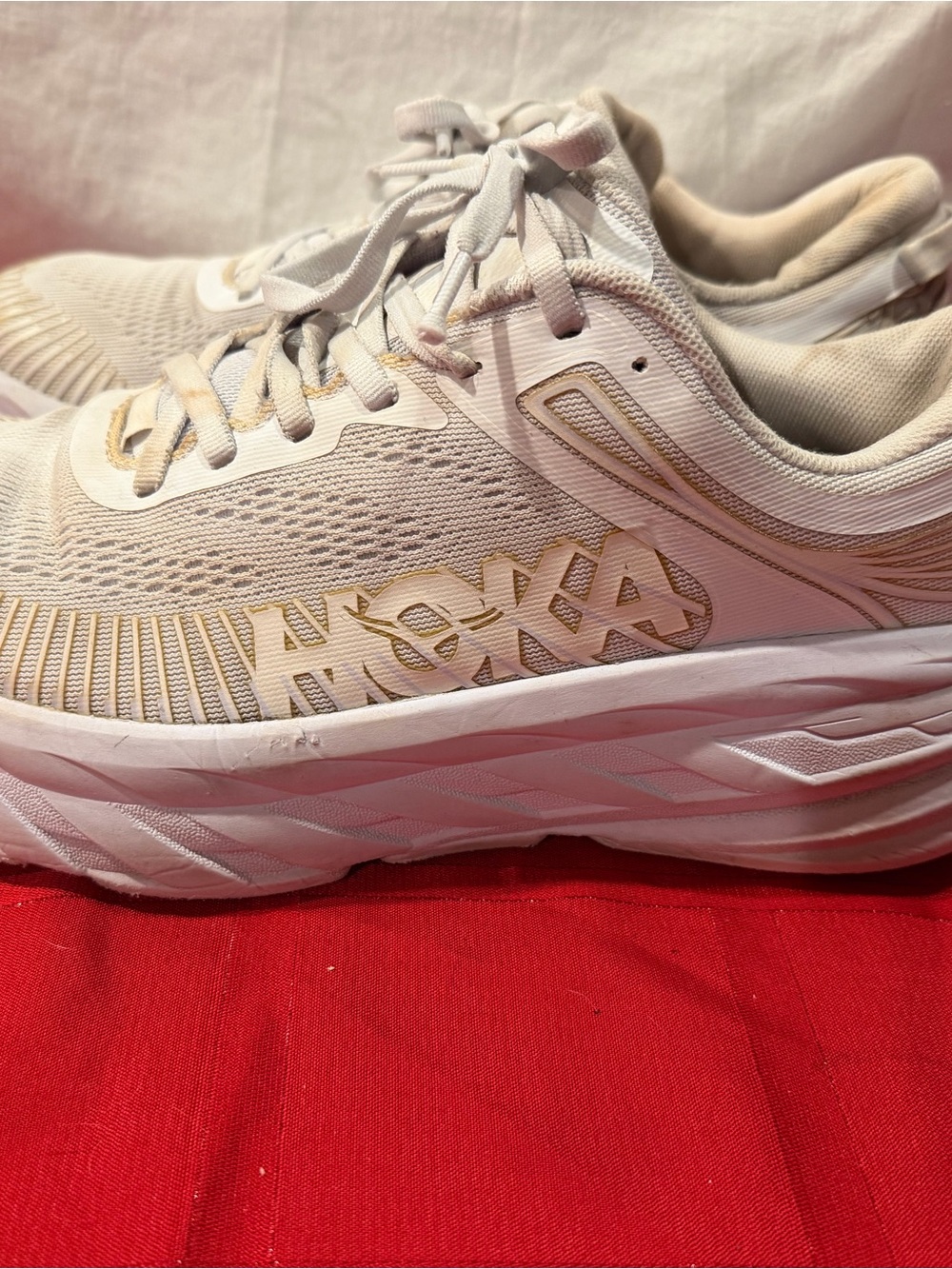Hoka Women's Running Shoes in Cream with Gold Accents